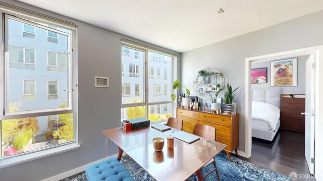 a living room with furniture and a table