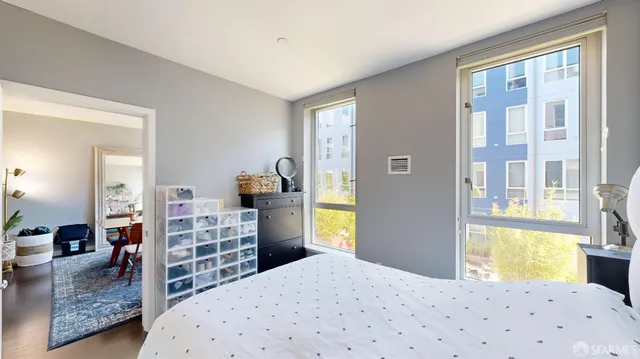 a bedroom with a bed and a dresser