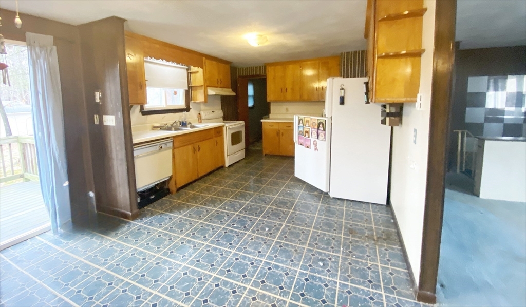 15 Cooper Road Northbridge, MA 01534 - Photo 4 of 22 a kitchen with a refrigerator sink and cabinets