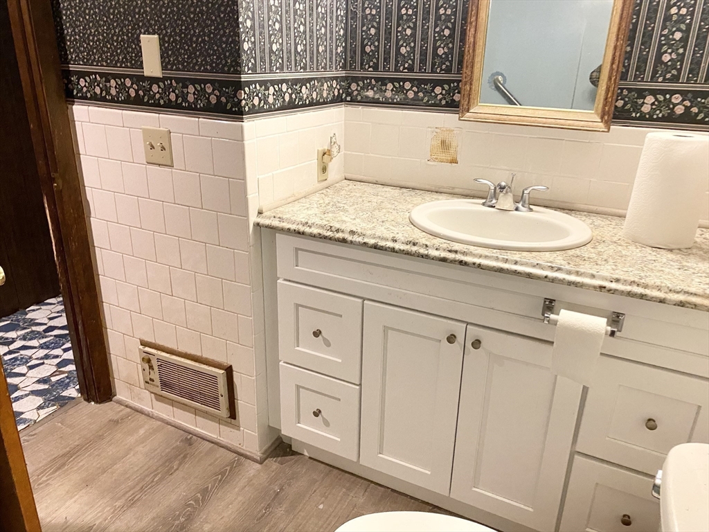 15 Cooper Road Northbridge, MA 01534 - Photo 10 of 22 a bathroom with a sink and a mirror