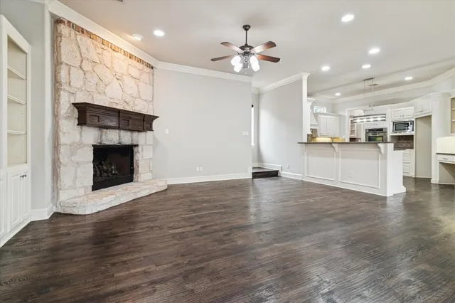a view of a kitchen with a stove cabinets and wooden floor