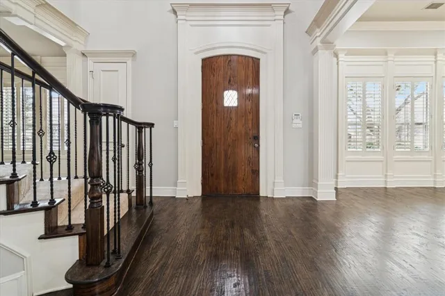 a view of an entryway with wooden floor