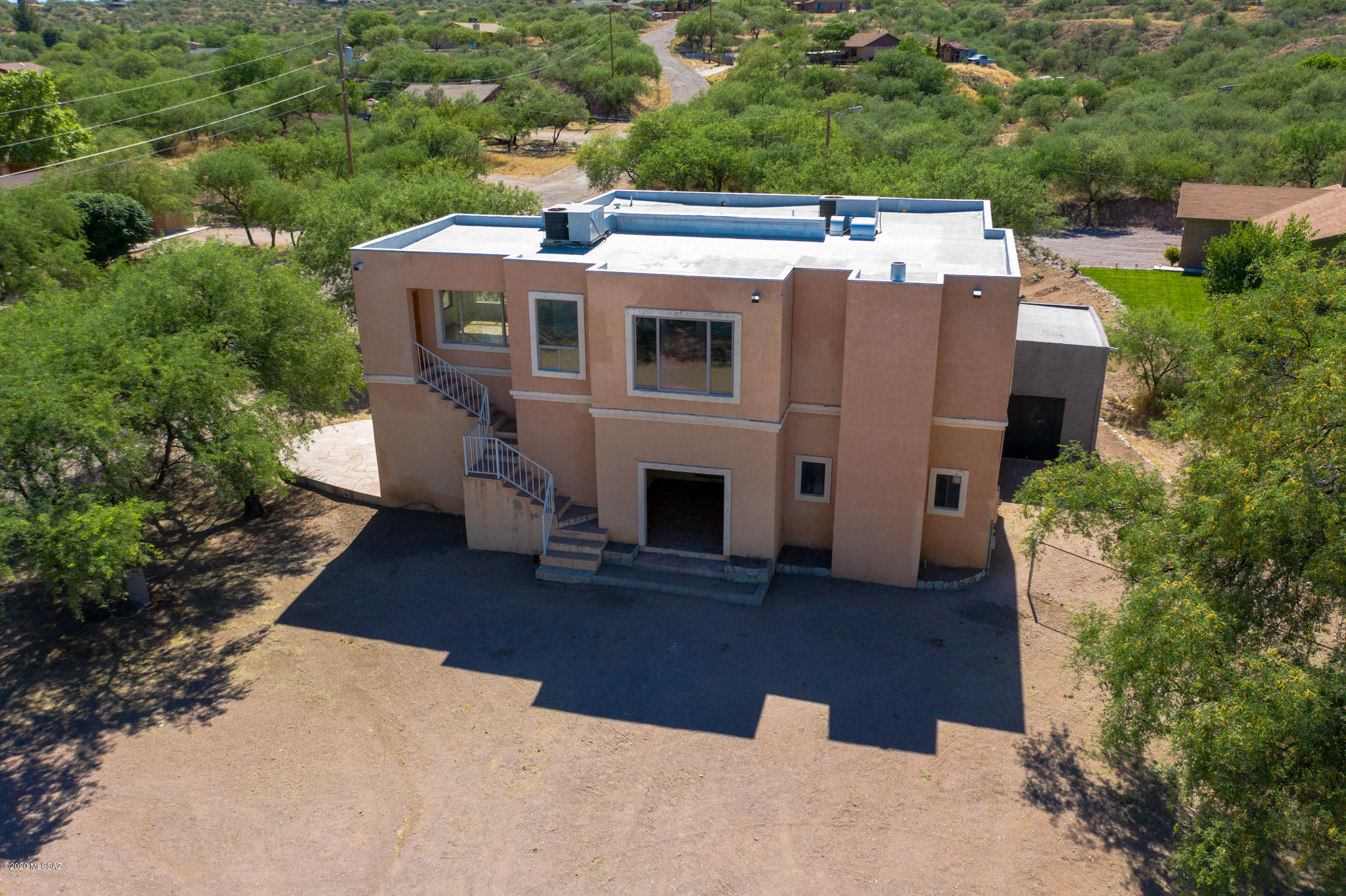 964 Calle Robalo Rio Rico, AZ 85648 - Photo 3 of 35 an aerial view of a house with a yard