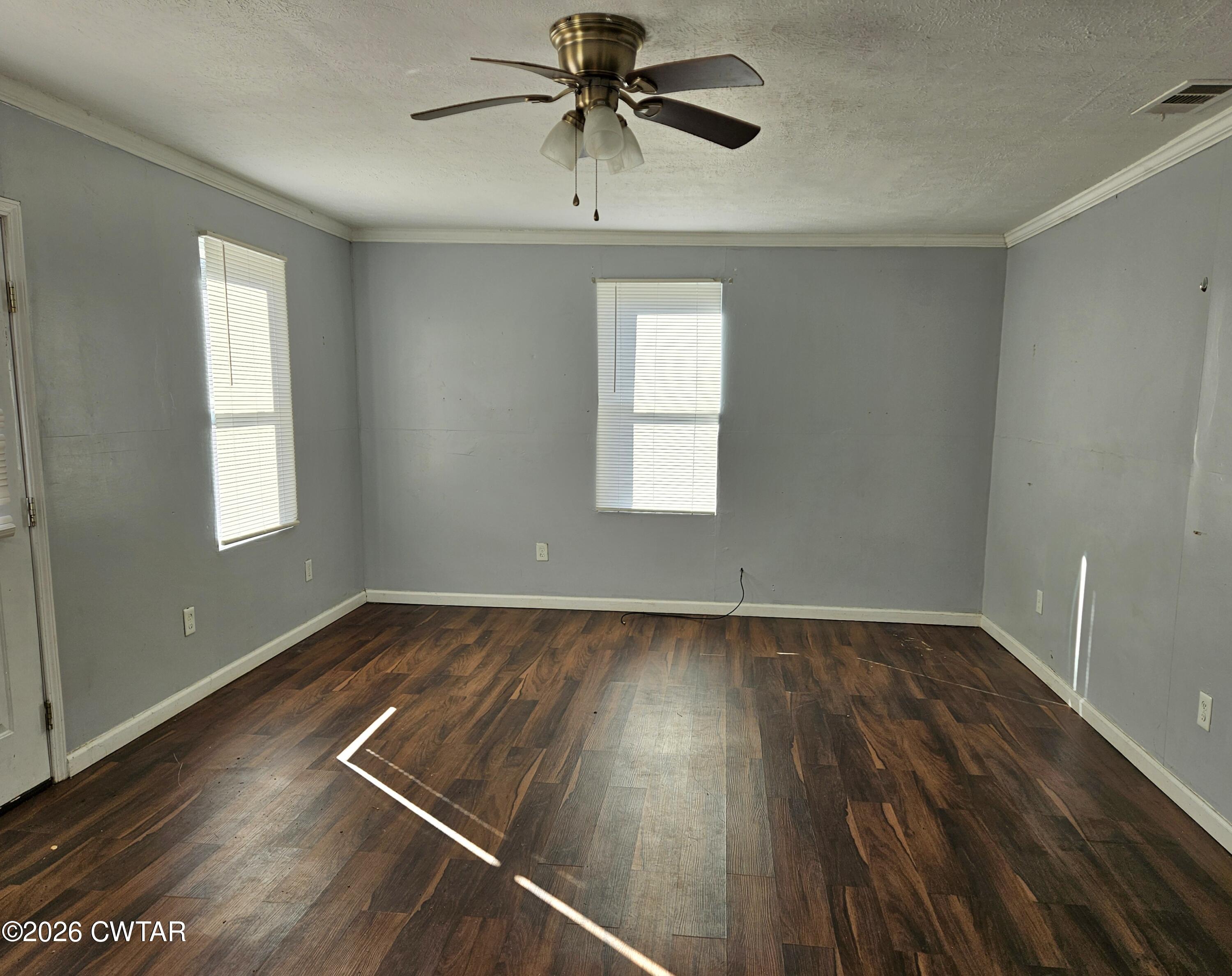32 Russell Road Jackson, TN 38301 - Photo 6 of 15 a view of a room with wooden floor and window