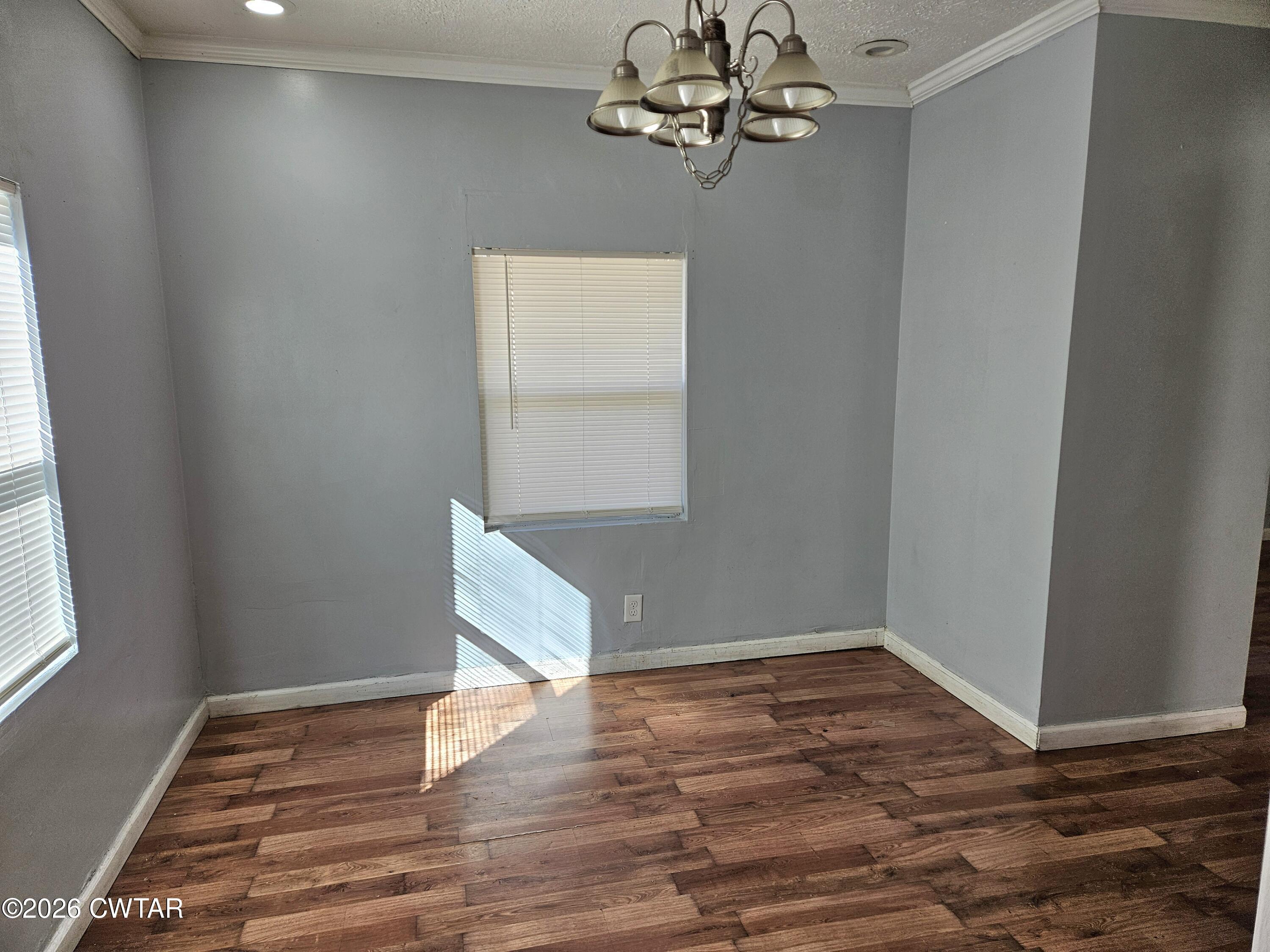 32 Russell Road Jackson, TN 38301 - Photo 8 of 15 a view of a room with wooden floor and chandelier