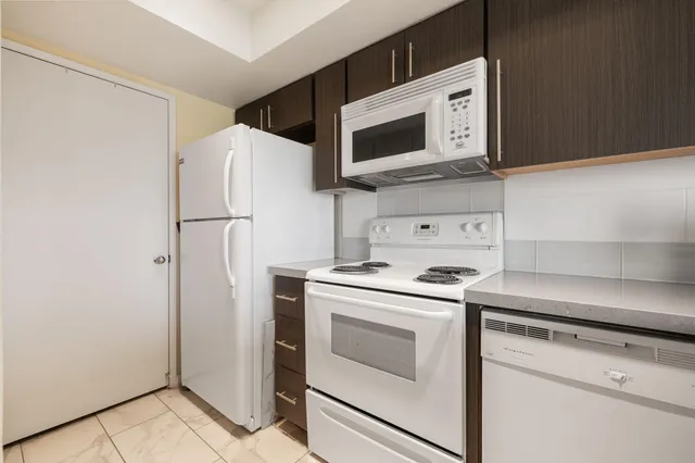 a kitchen with a stove microwave and refrigerator