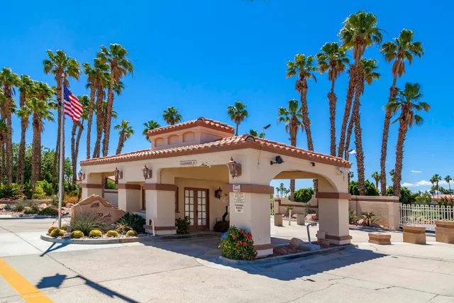 a bedroom with a bed and a lamp