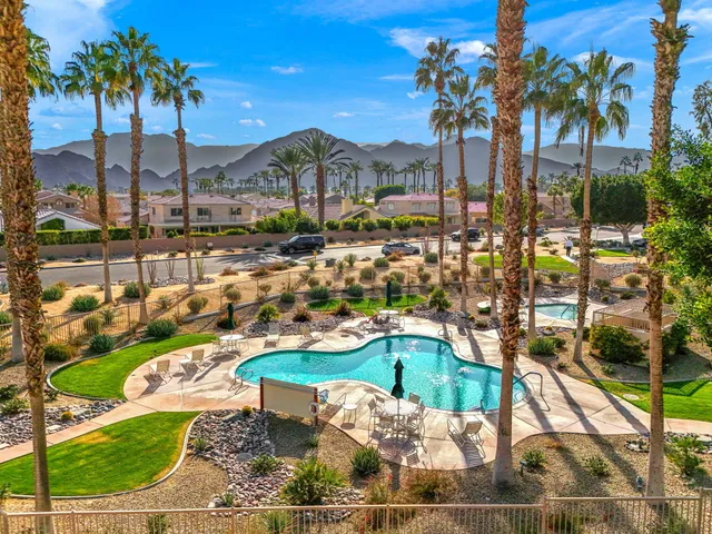 a large white kitchen with a large window