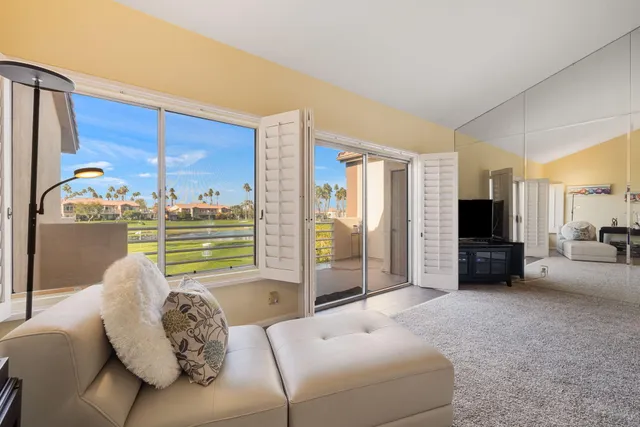 an aerial view of a houses with city view