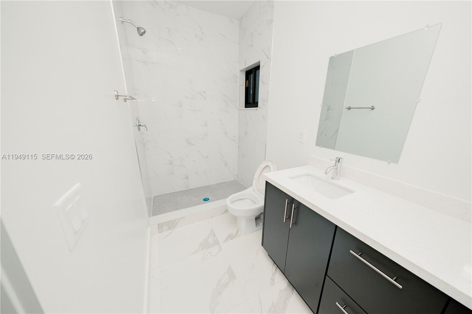 820 Northwest 18th Avenue Pompano Beach, FL 33069 - Photo 16 of 46 a bathroom with a sink a toilet and shower