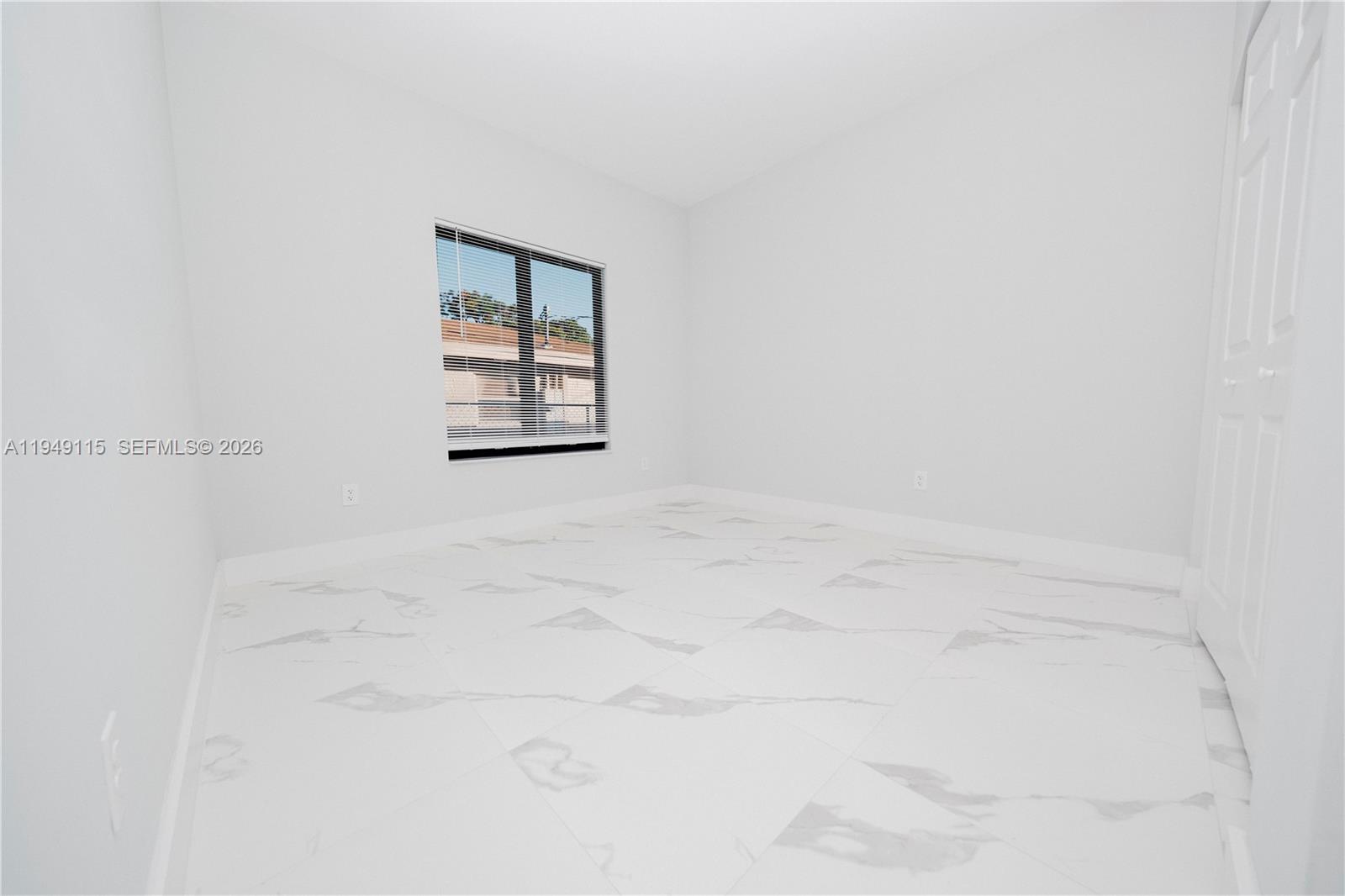 820 Northwest 18th Avenue Pompano Beach, FL 33069 - Photo 25 of 46 close up of a white marble wall