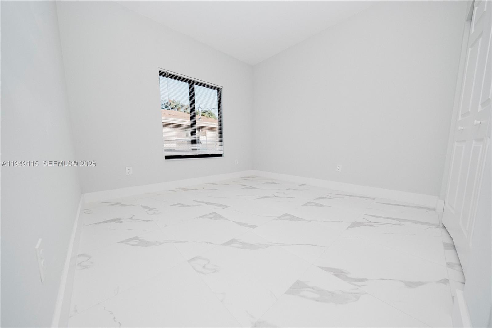 820 Northwest 18th Avenue Pompano Beach, FL 33069 - Photo 26 of 46 a view of a room that has a window in it