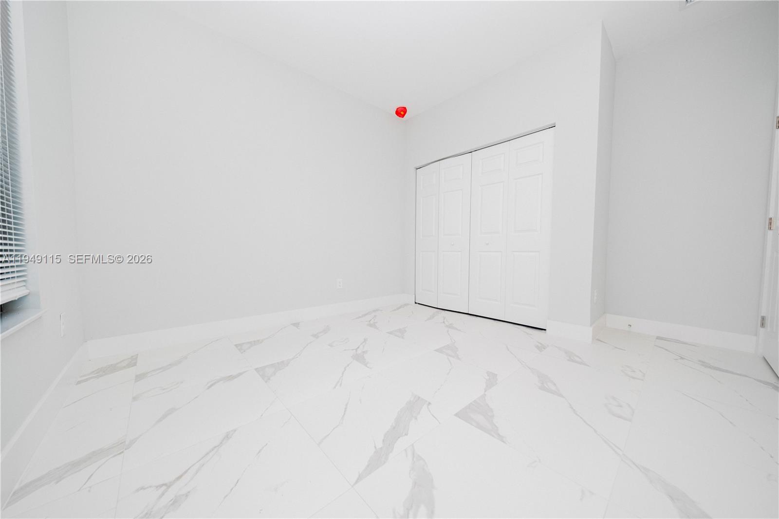 820 Northwest 18th Avenue Pompano Beach, FL 33069 - Photo 27 of 46 a view of a refrigerator in kitchen