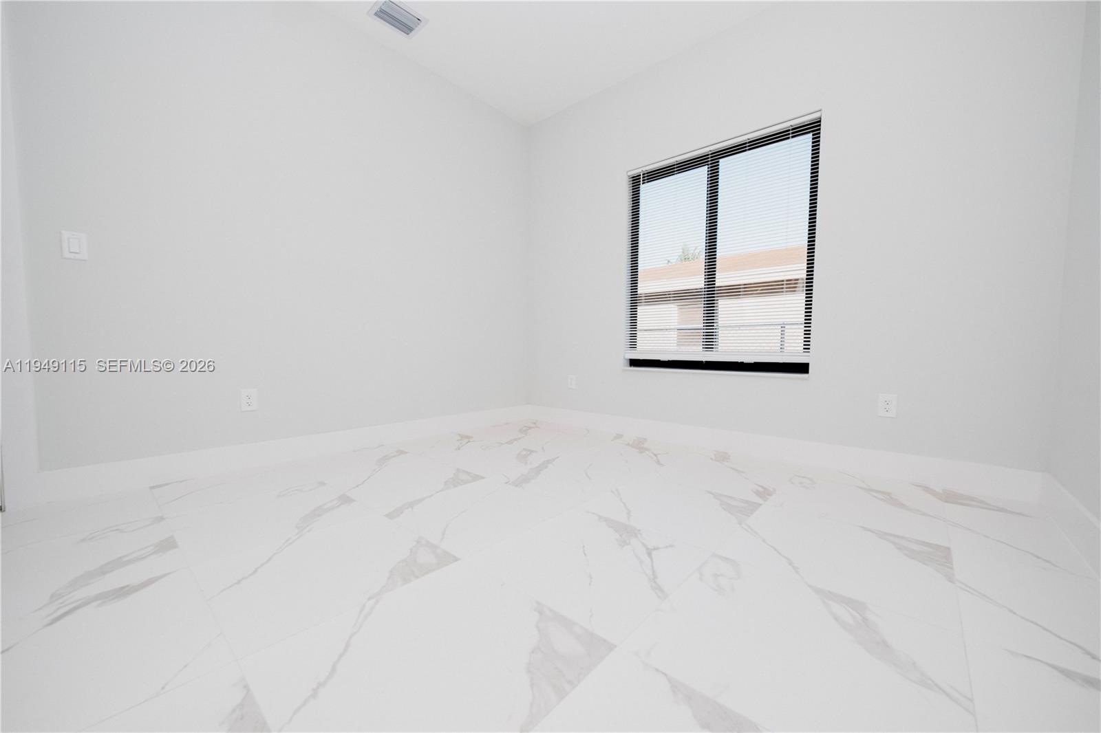 820 Northwest 18th Avenue Pompano Beach, FL 33069 - Photo 30 of 46 an empty room with a window