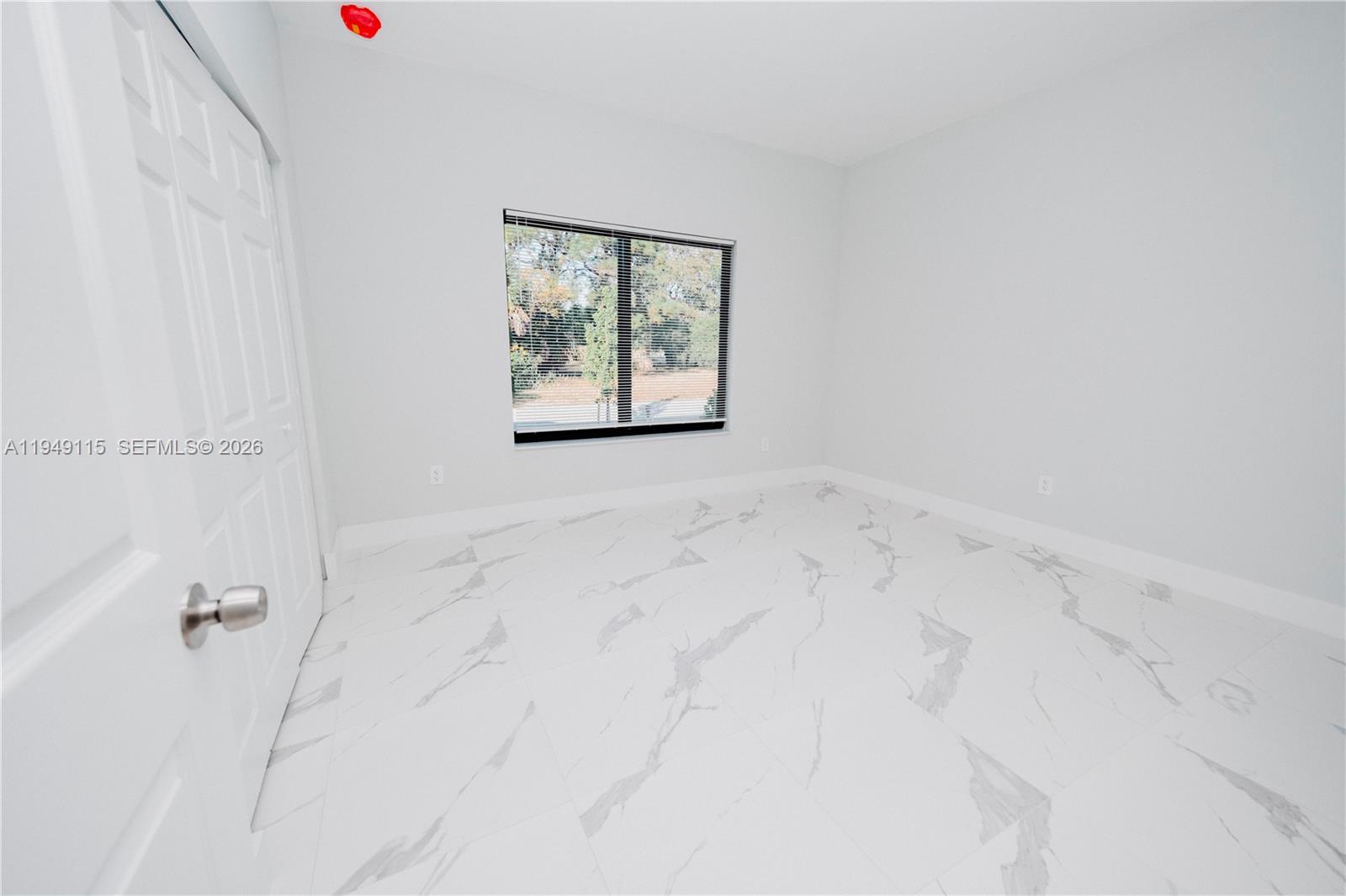 820 Northwest 18th Avenue Pompano Beach, FL 33069 - Photo 31 of 46 an white bath tub sitting next to a window