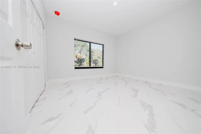 a kitchen with stainless steel appliances kitchen island sink refrigerator and stove