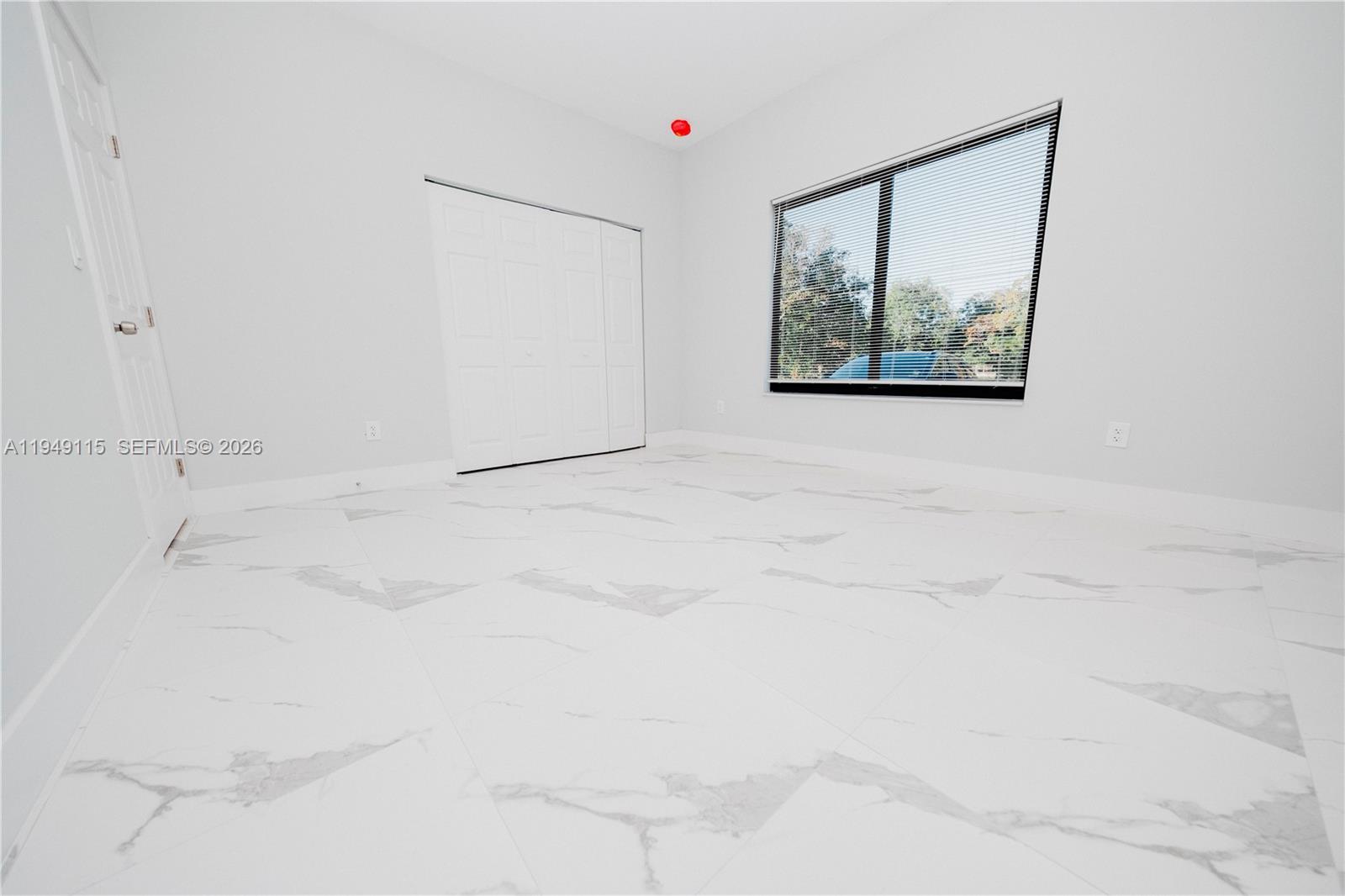 820 Northwest 18th Avenue Pompano Beach, FL 33069 - Photo 34 of 46 a white cabinet with white walls