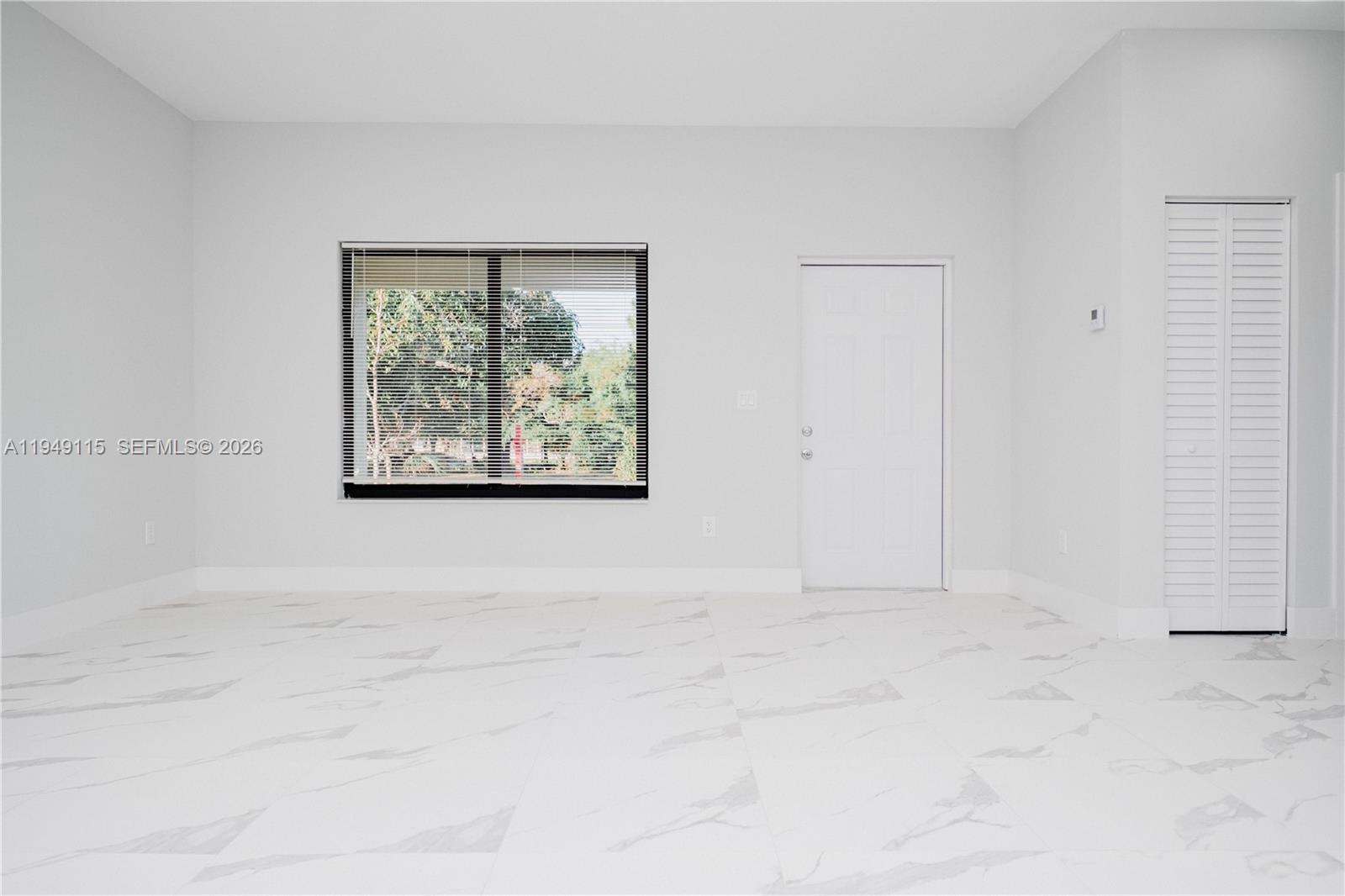 820 Northwest 18th Avenue Pompano Beach, FL 33069 - Photo 38 of 46 a view of an empty room with a window