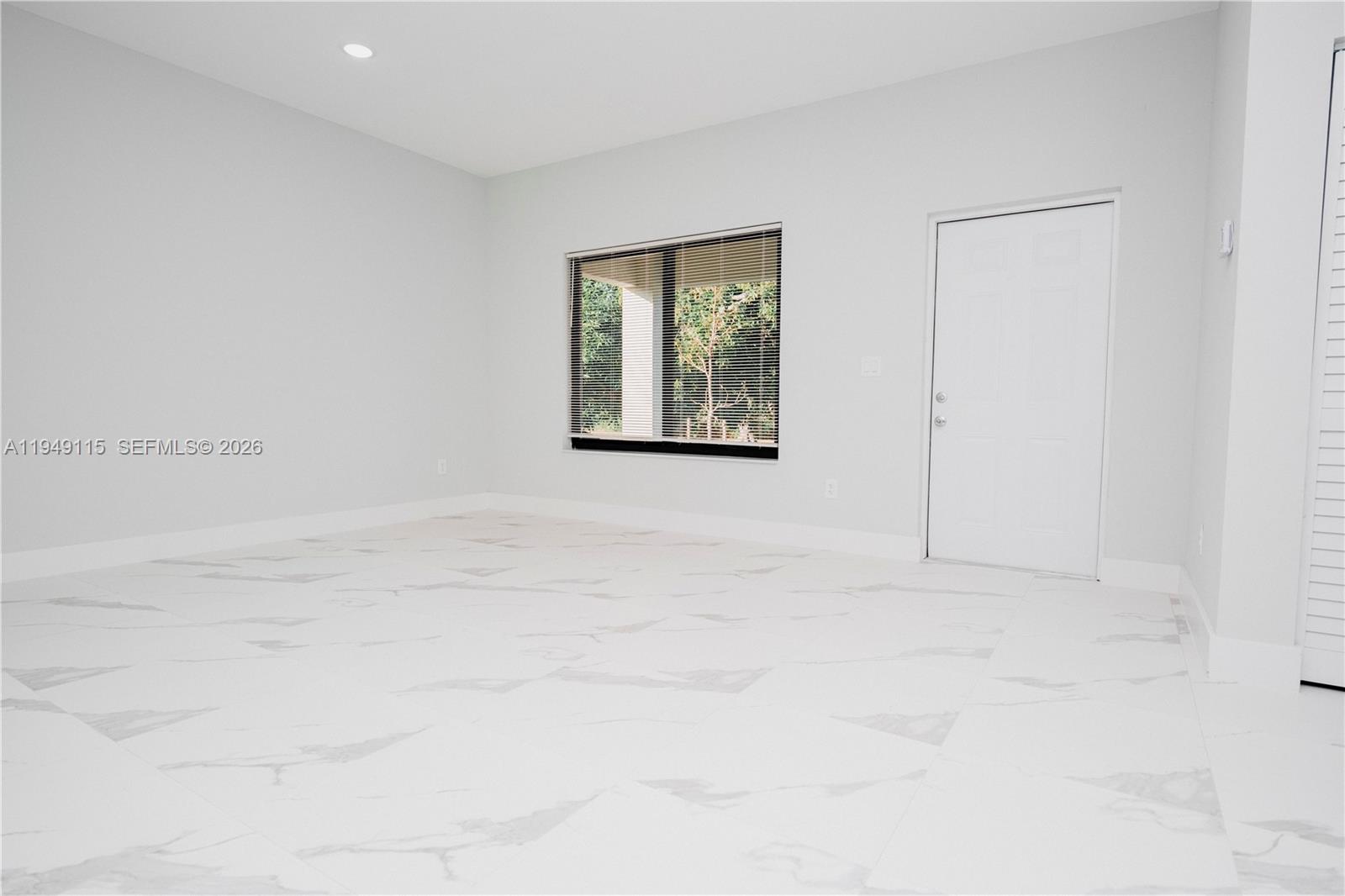820 Northwest 18th Avenue Pompano Beach, FL 33069 - Photo 39 of 46 an empty room with windows