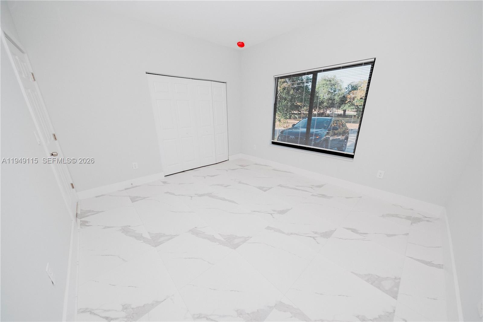 820 Northwest 18th Avenue Pompano Beach, FL 33069 - Photo 46 of 46 a white wall painting on the wall in a bathroom