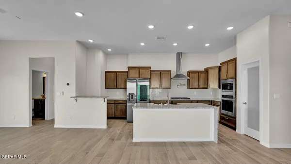 a kitchen with a sink a stove and cabinets