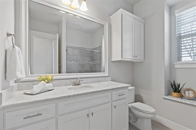 a work room with windows and wooden floor