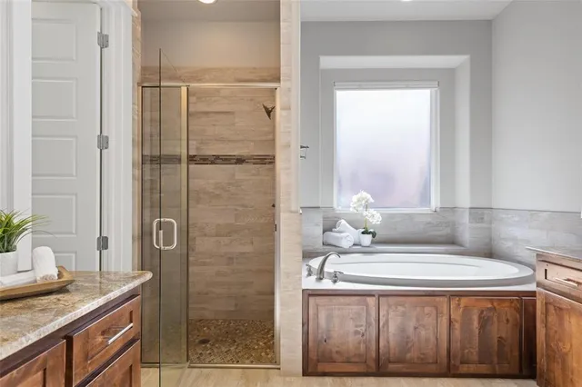 a bathroom with a sink double vanity and a mirror