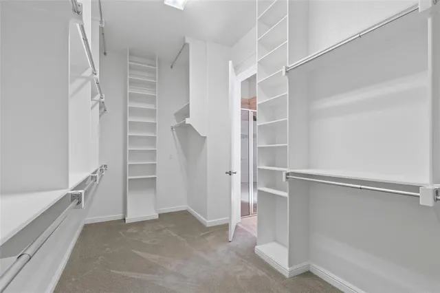 a spacious bathroom with a granite countertop sink and a mirror