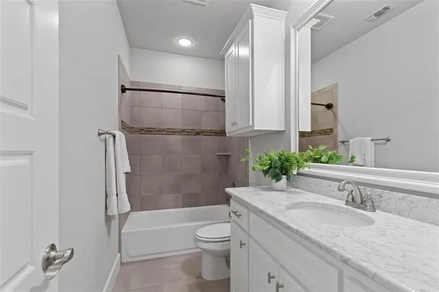 an empty room with fan and windows