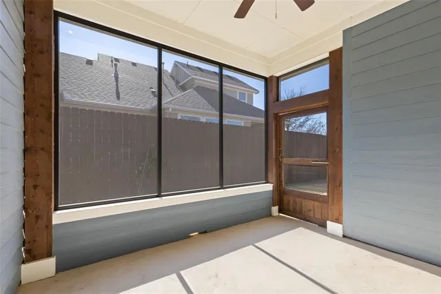 a view of an empty room with a fan