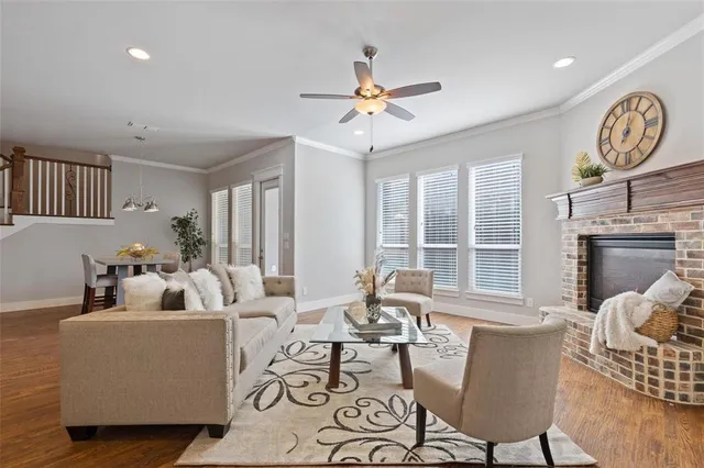 a living room with furniture kitchen view and a dining table