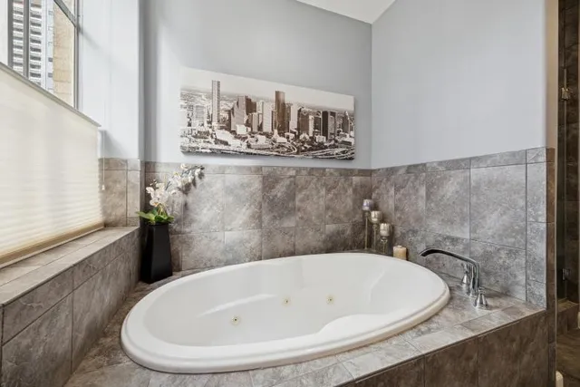 a bathroom with a tub and sink