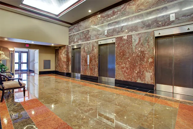 a front view of a building with a yard