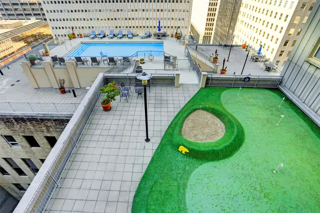 a view of swimming pool with outdoor seating