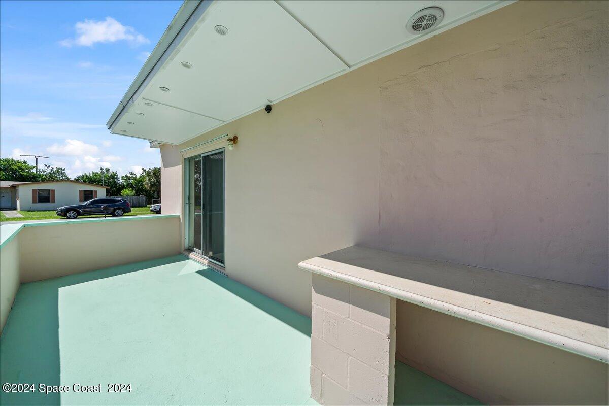 1049 Cable Lane Northeast Palm Bay, FL 32905 - Photo 18 of 24 Side Porch