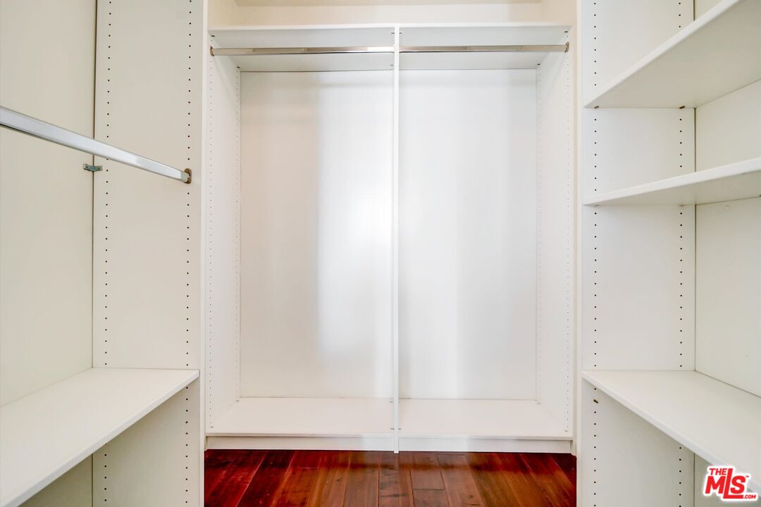 2160 Century Park, Unit 1503 Los Angeles, CA 90067 - Photo 17 of 22 a view of walk in closet with clothes