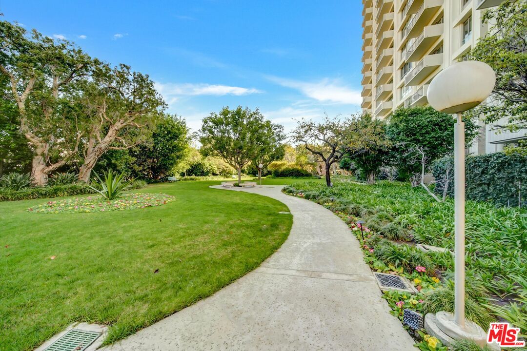 2160 Century Park, Unit 1503 Los Angeles, CA 90067 - Photo 19 of 22 a view of a garden with plants and large trees