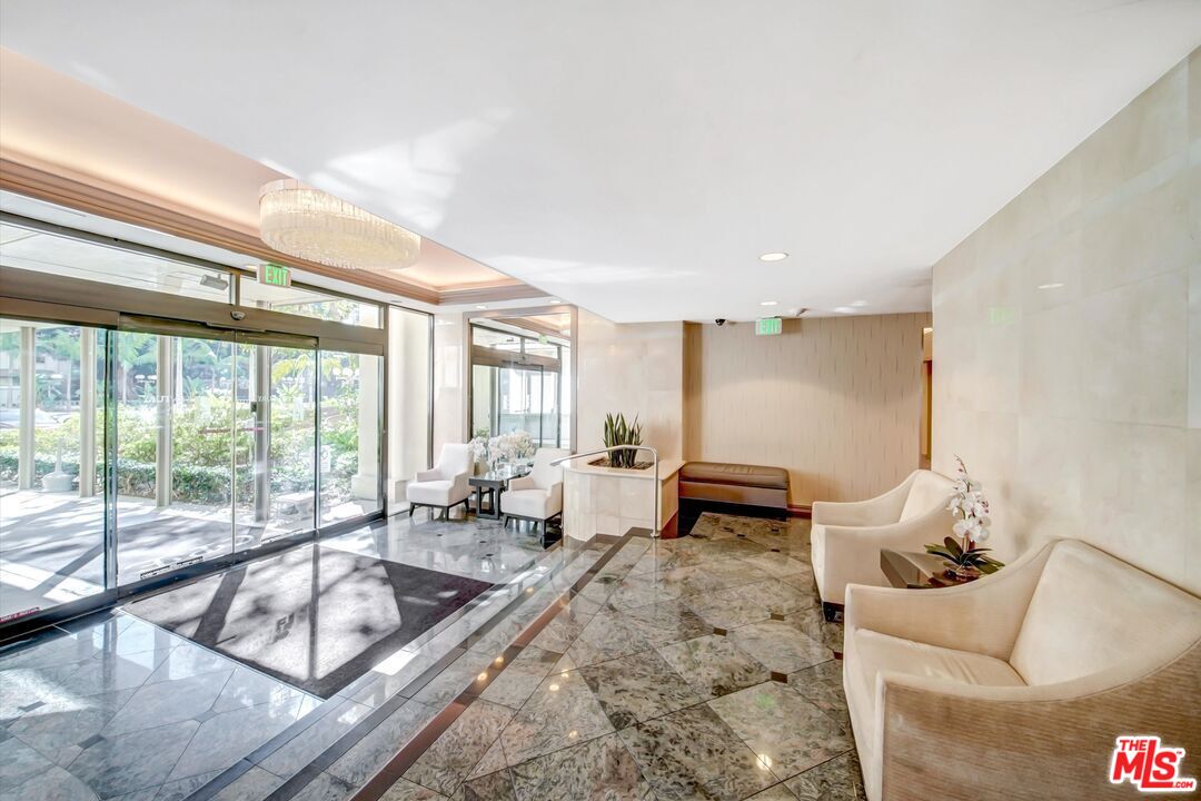 2160 Century Park, Unit 1503 Los Angeles, CA 90067 - Photo 6 of 22 a living room with furniture and a large window
