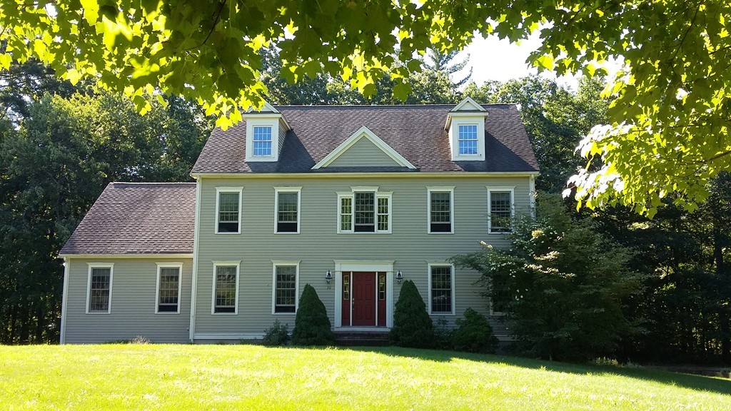 30 Mill Road Harvard, MA 01451 - Photo 1 of 21 a front view of a house with a yard