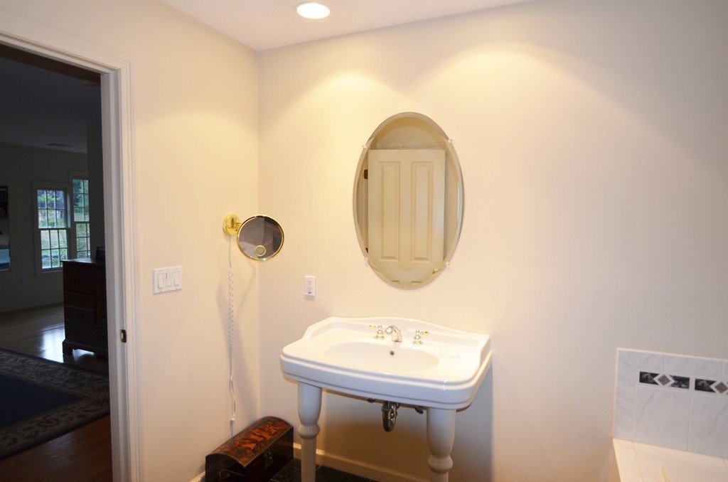 30 Mill Road Harvard, MA 01451 - Photo 14 of 21 a bathroom with a sink a mirror and a shower