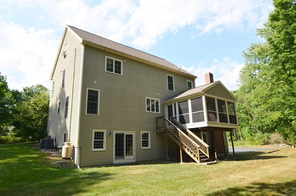 30 Mill Road Harvard, MA 01451 - Photo 17 of 21 a front view of a house with a yard