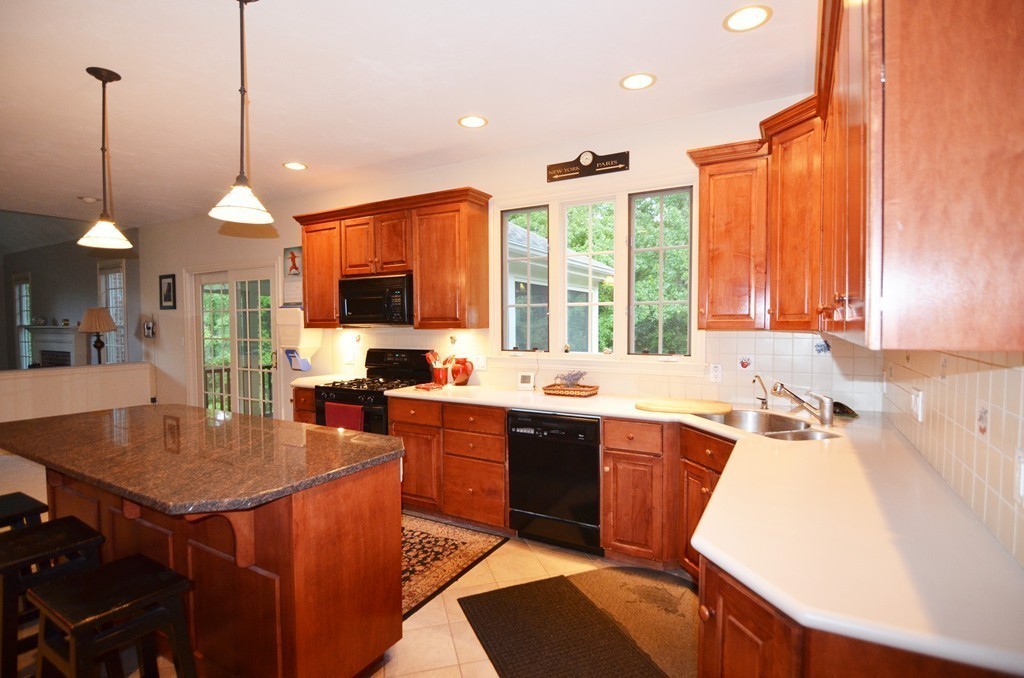 30 Mill Road Harvard, MA 01451 - Photo 5 of 21 a kitchen with stainless steel appliances granite countertop sink stove and refrigerator