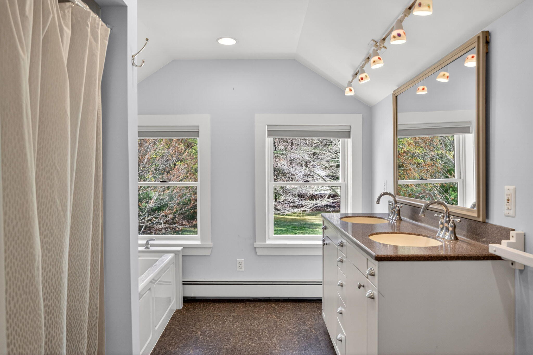 69 County Road Bourne, MA 02532 - Photo 32 of 54 a bathroom with a sink large mirror and a window