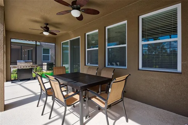 a view of swimming pool with outdoor seating and plants