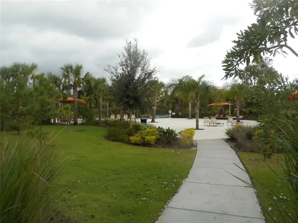 a view of backyard with a patio and outdoor seating