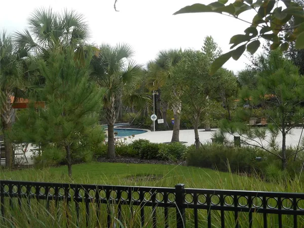 a view of a yard with patio
