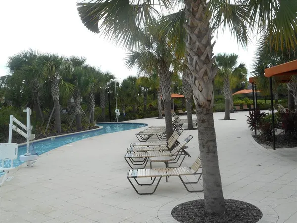 a view of swimming pool with a patio