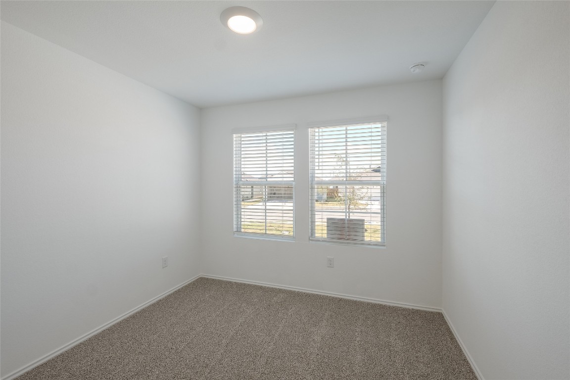 12202 Pike Bend Mustang Ridge, TX 78610 - Photo 19 of 24 an empty room with a window