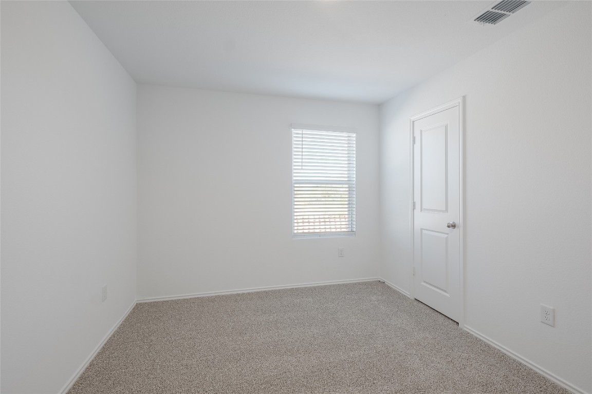 12202 Pike Bend Mustang Ridge, TX 78610 - Photo 21 of 24 an empty room with a window