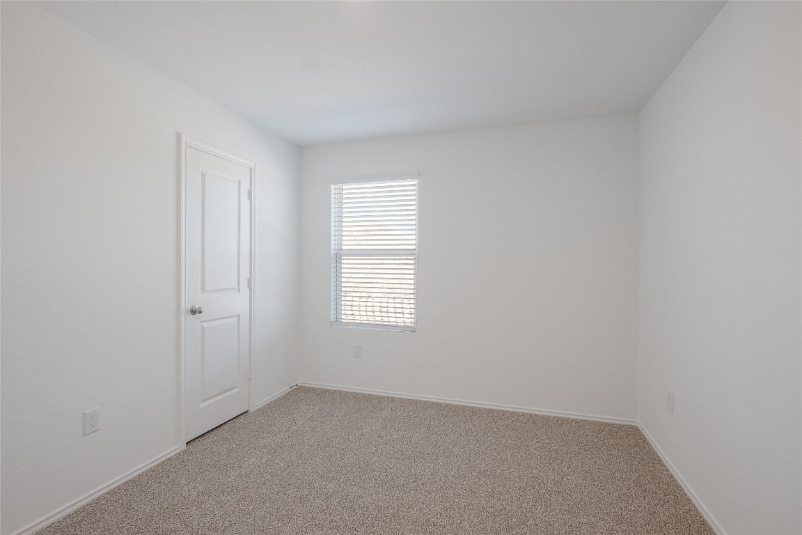 12202 Pike Bend Mustang Ridge, TX 78610 - Photo 22 of 24 an empty room with windows